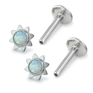 Pair of titanium earrings with sun bezels for new piercings