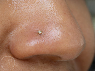 Nostril piercing with 1.5mm bezel gem