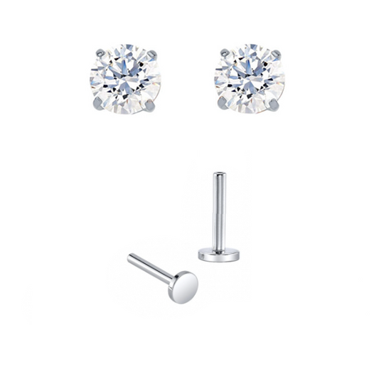 Pair of white gold prong-set earrings with gold posts for new piercings