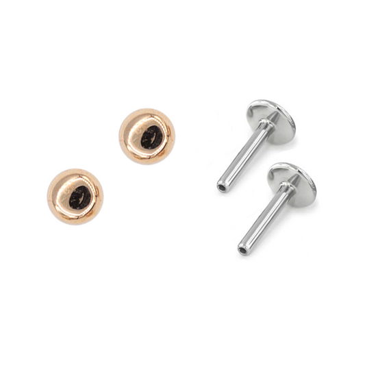 Pair of rose gold dome earrings with titanium posts for new piercings