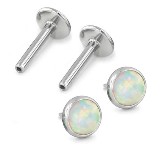 Pair of titanium earrings with cabochon gem for new piercings