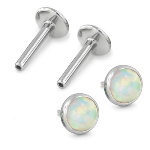 Pair of titanium earrings with cabochon gem for new piercings